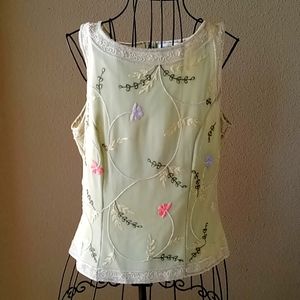 Beautiful hand beaded light green with various colored floral accents.